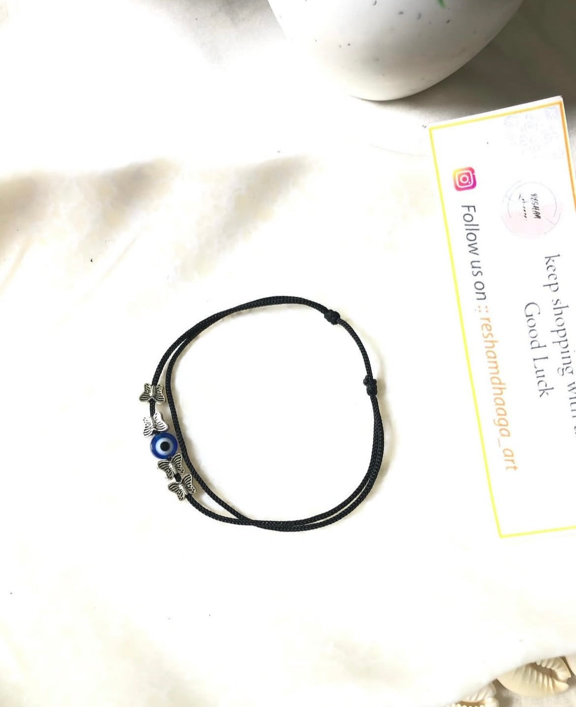 Evileye with small butterflies