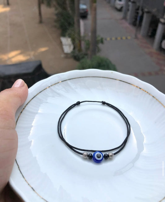 Evil eye with ball and beads